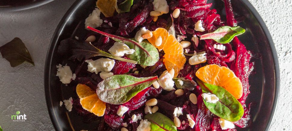 Beet and orange winter salad with goat cheese, baby greens, and pine nuts—anti-inflammatory recipe for weight loss in Mooresville, NC.