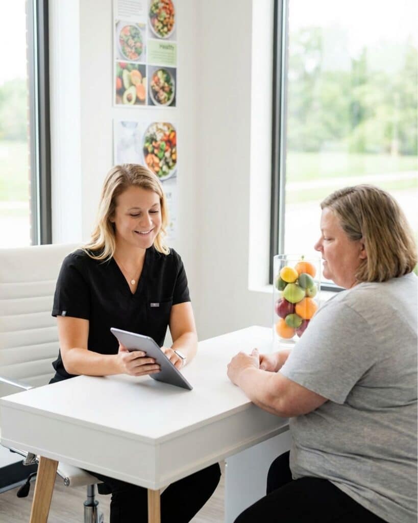MINT Nutrition dietitian reviewing a personalized nutrition plan during a weight management counseling session in Mooresville, NC.